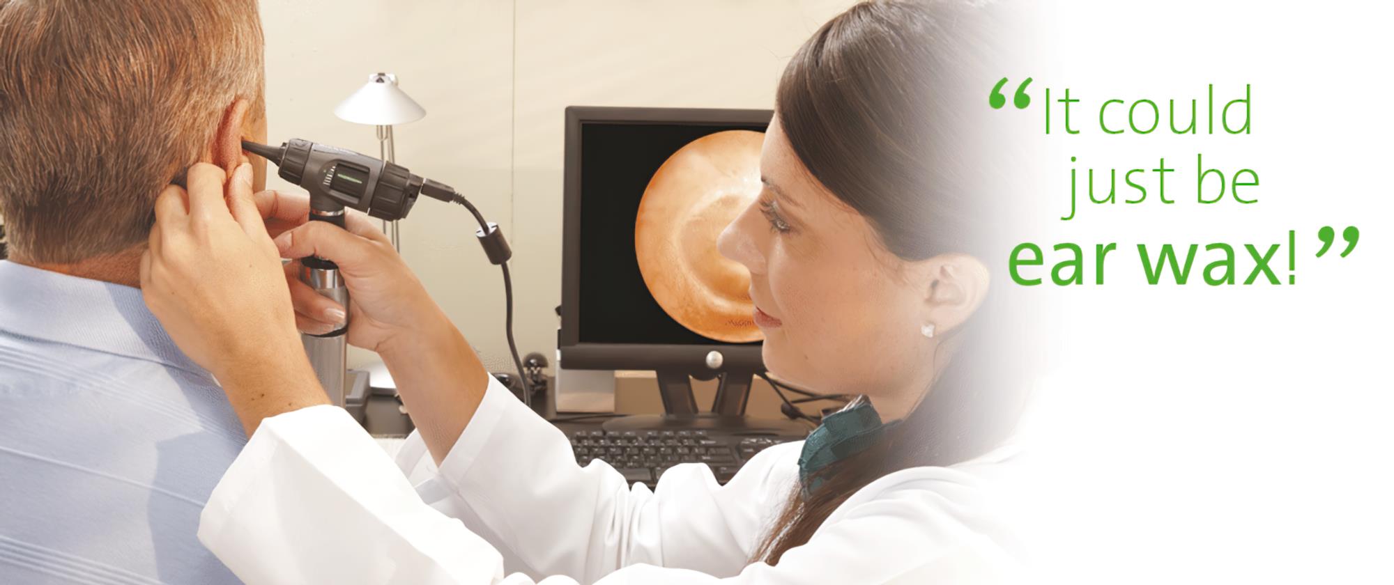 audiologist checking ear